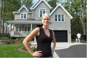 woman standing in front of new home